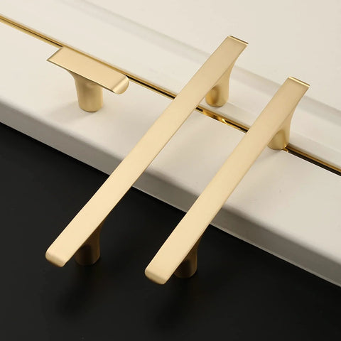 Brushed Gold Cabinet Pulls Pack Of 10, 5 Inch Hole Centers, Zinc Alloy And Brass Construction, Kitchen Handles on white surface ZH0028