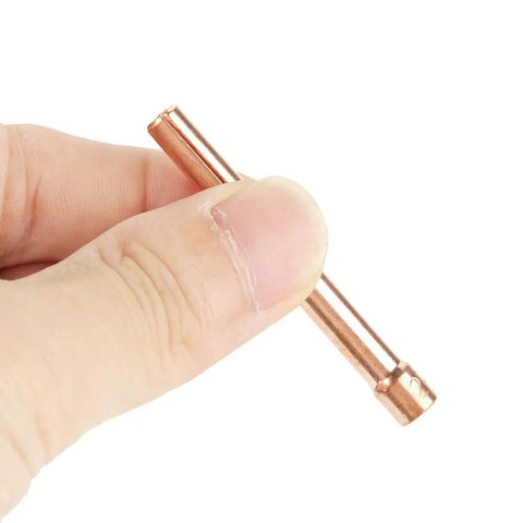 Hand holding 10Pcs Copper Welding Collets Set 2.4mm Hole For WP 17 18 26 Torches Durable Heat Resistant Replacement Parts
