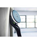 Close-up of PLANEX LHS 2 225 EQI Plus Drywall Sander With LED Ring Light arm against wall for smooth finish