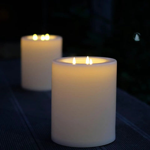 XL Flameless Pillar Candles With Remote, Outdoor Weatherproof LED Candles, 6.45 By 8 Inches on a patio, warm flickering light