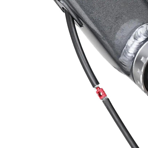 Close-up of red connector from Colorful Bike Brake And Shift Cable Connectors Kit, 20 Pcs, 4 Color Set with Routing Tool.