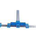 Precision Aluminum Punch Locator Drill Guide Jig For Pro Level Cabinetry And Carpentry with ruler measurement in blue.