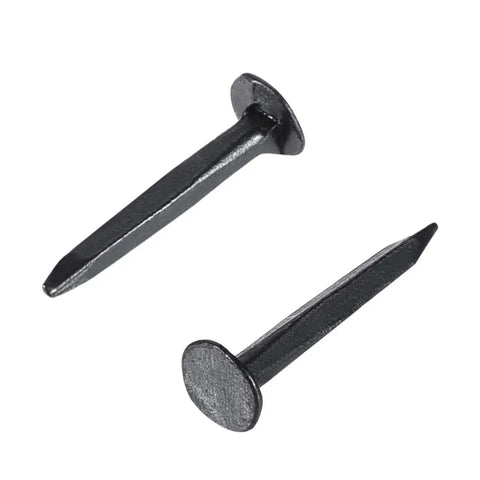 Close-up of 1000 Pack Half Inch Black Iron Shoe Nails Rust Resistant Boot Studs, showcasing flat head and sharp tip design.