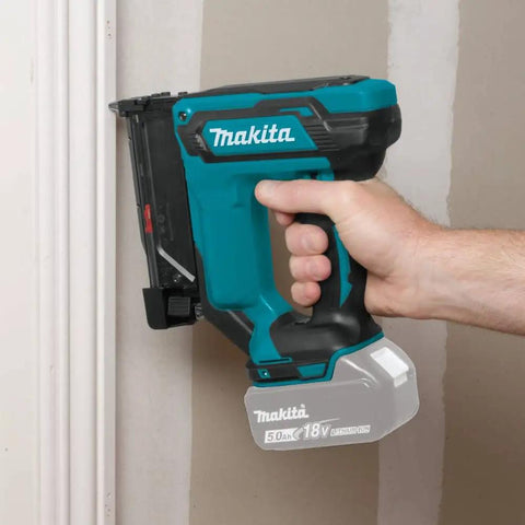 Cordless 18V LXT 23 Gauge Pin Nailer Pro Grade in use on trim work, lightweight low-recoil nail gun, close-up in action