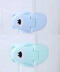 Bear Shaped Cabinet Locks For Kids 3 Pack ABS Safety Latches on cabinet doors, blue and mint colors, childproof design.