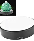 F&Y 360 Degree Electric Rotating Mirror Display Stand with flexible speed turntable showcasing a green statue.