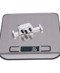 Beefed Up Metal Transfer Case With Reverse Shaft For 1/10 LCG RC Crawler SCX10 Chassis Upgrade Parts on digital scale.