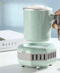 Smart Desktop Beverage Chiller With Rapid Freeze And Instant Heat Mode Made From Food Grade Aluminum for a beverage in use.