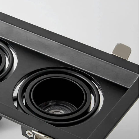 Close-up view of Top Shelf Adjustable Recessed Lighting Kit featuring gimbal downlights in black finish, 15W square can.