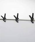 Three black nylon spring clamps from 14 Piece Nylon Spring Clamp Set For Photography, Woodworking And Crafts holding a backdrop.