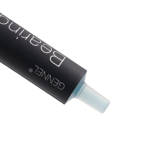 Pro Grade High Performance Spindle Lubricant Oil And Bearing Grease tube with nozzle visible.