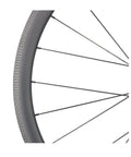 Close-up of Thirty Eight Millimeter Carbon Clincher Road Bike Wheelset Tubeless Ready Rim Brake with Sapim CX Ray Spokes.