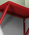 A red metal bracket support structure mounted on a concrete wall, used for securing shelves or units with strong anchoring.