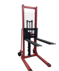 Heavy Duty Manual Pallet Stacker Featuring A No Sweat 2200 Pound Hydraulic Lift And Sixty Three Inch Rise For Warehouse Grinds And Factory Material Hauling Straight Up Shop Floor Legend, red metal frame with black forks.