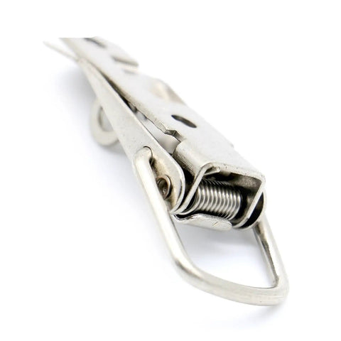 Close-up of iron spring-loaded toggle latch for cabinets, sliding doors, windows, and furniture hardware, fits 27x63mm standard size