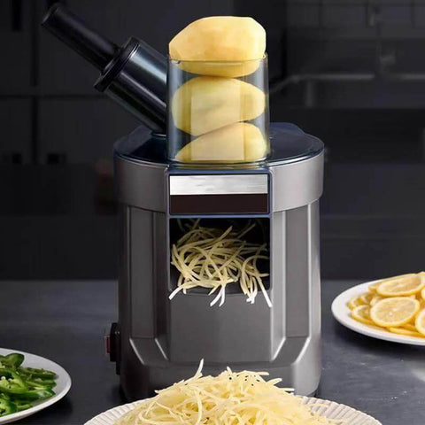 Front view of a gray 4-in-1 electric vegetable slicer and chopper with dual feed chutes; potatoes stacked on top.