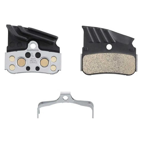 N04C Metallic Brake Pads For XTR XT SLX Four-Piston Disc Brakes with metal backing and retention clip visible