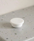 5pcs White Silicone Stopper for 30-31mm Bathtub Jet Holes on a countertop for easy installation and leak prevention.