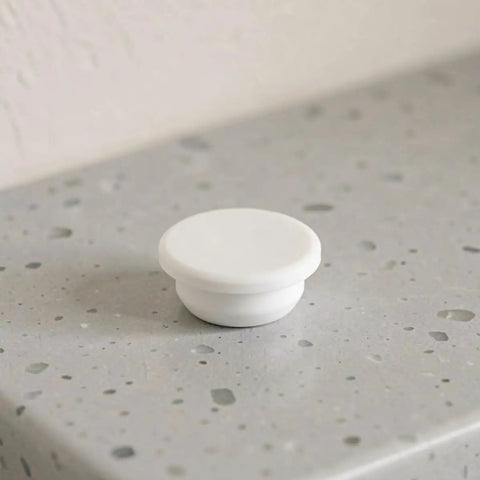 5pcs White Silicone Stopper for 30-31mm Bathtub Jet Holes on a countertop for easy installation and leak prevention.