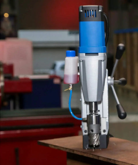 Portable Dual Gear Magnetic Drill Press 110V Made In Germany With 2 Inch Hole Capacity shown in workshop setting