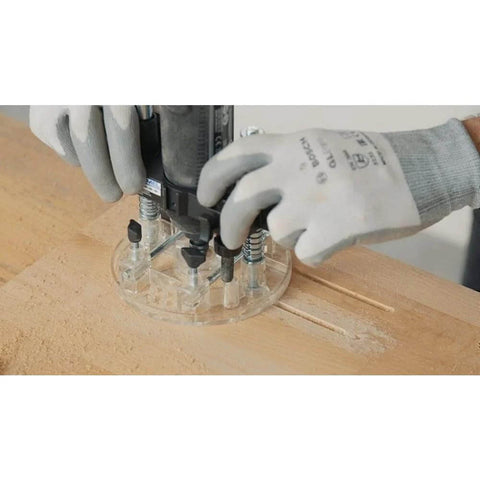 Installed Dremel 335-01 plunger router attachment with clear plastic base plate routing wood