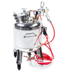 Built Rock Solid 30 Liter Stainless Steel Air Spray Gun With Precision Pressure Gauge and Auto Safety Valve showing sleek design and attached hoses.