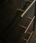 Close-up of metal handles on dovetail drawers of L Shaped Lift Top Standing Desk 56 Inch Wide Hardwood Corner Workstation.