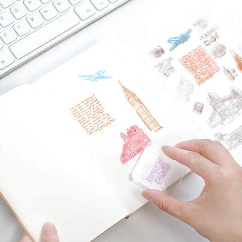 12 Piece Clear Acrylic Stamp Block Set With Assorted Sizes For Scrapbooking And Card Making, Transparent Mounting Blocks With Grid Lines For Precise Alignment, Must Have For Crafts Stamping Projects And DIY Cards. Clear acrylic stamp block on scrapbook page with hand stamping design.