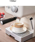 One Touch Coffeehouse Espresso Maker And Cappuccino Machine With 15 Bar Pump 1050W Power brewing coffee into cup on table