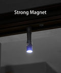 Four Thousand Lumen EDC Rechargeable Flashlight With Magnetic Base And Battery Indicator For Hands Free Work hanging upside down.