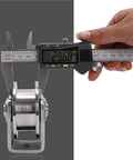 Set Of Two Heavy Duty 304 Stainless Steel Sliding Door Rollers being measured at 29.68 mm with caliper for precise dimensions.