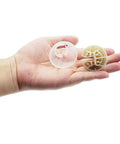 Hand holding suspension balls from Washer Suspension Rod Kit For Whirlpool Amana NTW Series 25.5 Inch Replacement