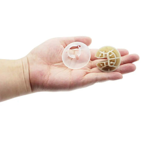 Hand holding suspension balls from Washer Suspension Rod Kit For Whirlpool Amana NTW Series 25.5 Inch Replacement