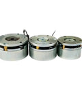 Three silver electromagnetic holding brakes with mounting plates and wiring for servo motors.