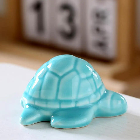 Heckin Adorable Ceramic Sea Turtle Toilet Bolt Caps Set Of 2 Snazzy Screw Cover in light blue, decorative bathroom accessory.
