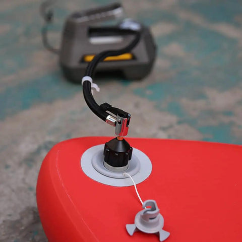 Inflatable Boat and SUP Pump Adapter for Schrader Valve Lets You Connect Any Electric, Foot, or Compressor Pump Easily, Works on Most Inflatable Boards and Boats, Spoke Plate Attachment, Black and Orange attached to an inflatable board valve