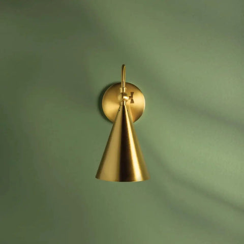 Lupe Wall Sconce Brass With Perforated Shade And Bowtie Swivel Dope Industrial Chic Meeting Midcentury Modern And Traditional Vibes