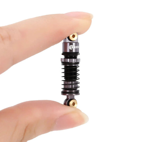 Close-up of gray Beefed Up 39mm Aluminum Threaded Shocks With Preload Adjustable Bodies And Internal Oil Dampers for 1 to 24 RC crawlers.