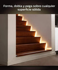 Hue LightStrip Plus Dimmable LED Smart Light Extension for Ambient Mood Lighting illuminating wooden staircase