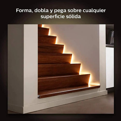 Hue LightStrip Plus Dimmable LED Smart Light Extension for Ambient Mood Lighting illuminating wooden staircase