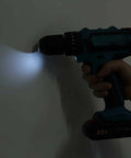 21V Lithium Ion Cordless Drill And Impact Driver Set Featuring Variable Speed Control Ergonomic Rubber Grip No Sweat Operation in use on a wall.