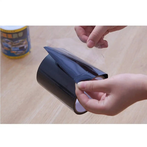 Heavy Duty Black PVC Repair Sealant Tape Waterproofs Leaks And Cracks Instantly For Kitchen Pipes Drains And Bathroom Fixings With Super Sticky Adhesion That Holds Tight Without Dripping Or Peeling Off No Matter How Wet It Gets So You Can Banish Those, being unwrapped.