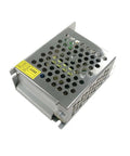 12V 2A DC Transformer Power Supply For 110V To 220V AC Input Converts To Stable 12V DC For Motors And Gadgets Easy Plug And Play Voltage Converter Safe Reliable Power Unit. Compact silver unit with perforated casing.