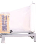 Heavy Duty Manual Table Stretch Film Dispenser For Pallet Wrapping Featuring Adjustable Tension Knob For No Hustle And Quick 12 To 20 Inch Roll Loading with box wrapped in clear film.