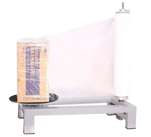 Heavy Duty Manual Table Stretch Film Dispenser For Pallet Wrapping Featuring Adjustable Tension Knob For No Hustle And Quick 12 To 20 Inch Roll Loading with box wrapped in clear film.