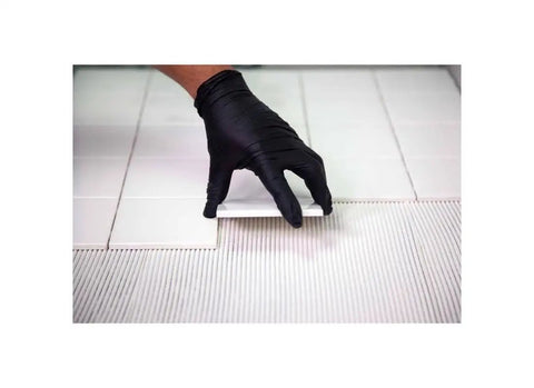 Worker applying Easy To Use Acrylic Ceramic Tile Mastic Adhesive One Gallon For Pro Grade Floor Tile Bonding Quick Set And Strong Hold