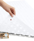 Premium Non Slip Bath Mat With Power Traction Suction Cups That Stay Locked For Stable Bathtub Floor Liner Featuring Rapid Moisture Escape Panels And No Fuss Cleanup Style In Crisp White Dimension Thirty Five By Sixteen shown from above with hand lifting one corner.