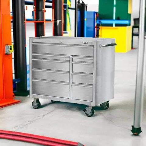 Top Shelf 9 Drawer Stainless Steel Tool Cabinet Rock Solid Rolling Chest Premium 304 Build shown in workshop setting.