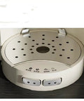 Close-up of Automatic Coffee Maker With Built In Grinder And Insulated Travel Cup's drip tray and control buttons.