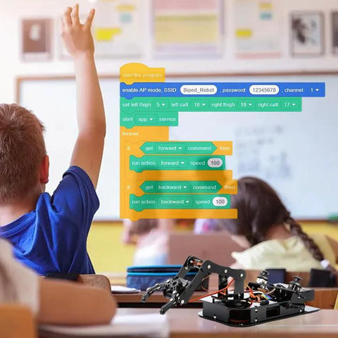 Toy robotic arm kit, 4-DOF ESP32, black metal frame on classroom desk, front view